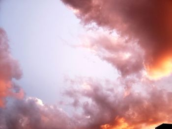 Low angle view of dramatic sky during sunset