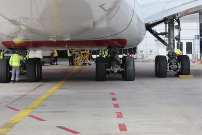 View of airplane at airport runway