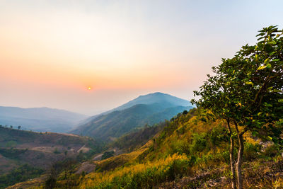 Scenic view of mountains against sky during sunset