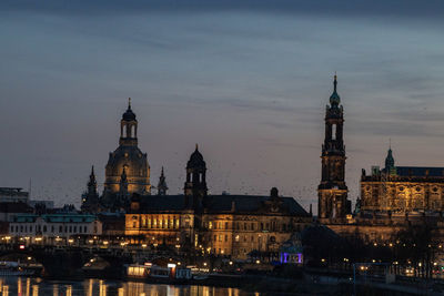 Illuminated buildings in city at night