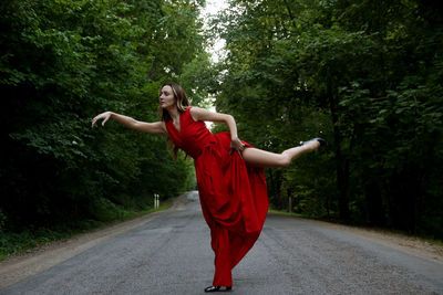 Full length of woman walking on road