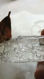 Close-up of sea splashing water against sky