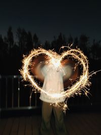 Close-up of light painting against black background