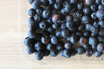 High angle view of grapes in container on table