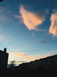 Low angle view of built structure against sky at sunset