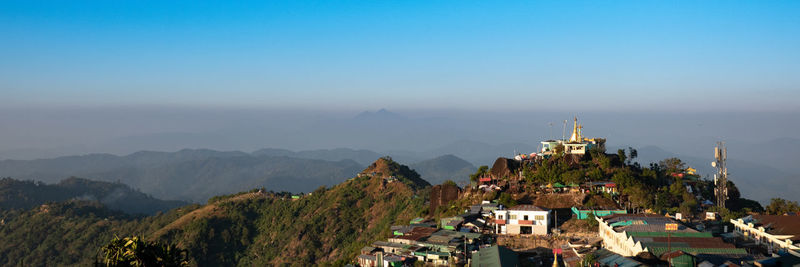 High angle view of buildings and mountains against sky