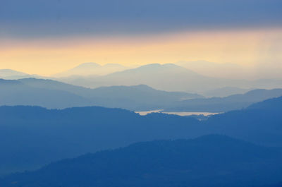 Scenic view of mountains against sky during sunset