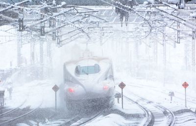 Tokaido shinkansen n700s passing through maibara station at snowy day