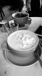 Close-up of coffee cup on table