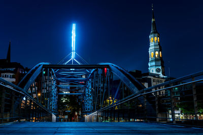 Illuminated modern building against sky at night