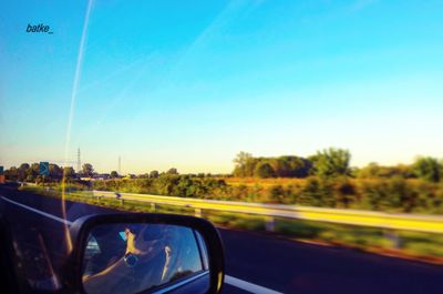 View of road seen through car windshield