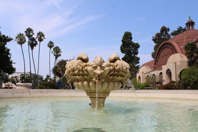 Group of people at swimming pool against sky