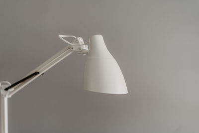 Close-up of electric lamp against white background