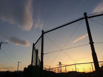 Low angle view of silhouette trees against sky