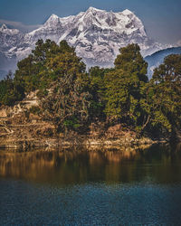 Scenic view of snowcapped mountains and lake