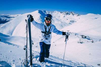 Man skiing on snowcapped mountain during winter