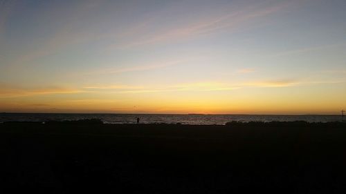 Scenic view of sea at sunset