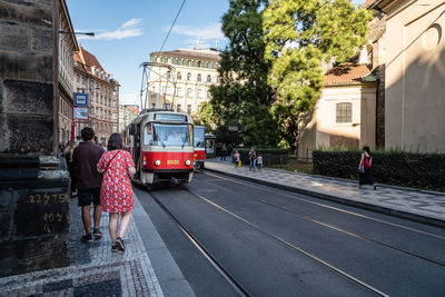 People on sidewalk in city