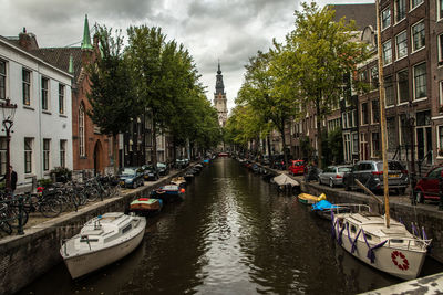 Boats moored in canal