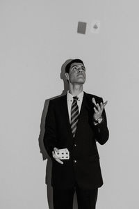 Full length of a man standing against white background