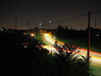 High angle view of light trails on street at night