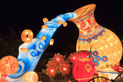 Low angle view of illuminated carousel