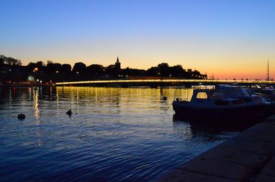 Boats in front of river