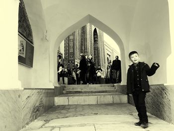 People standing in corridor of building