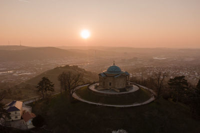 High angle view of buildings in city against sky during sunset