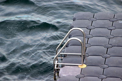 High angle view of ladder by sea