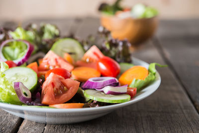 Close-up of chopped fruits in plate on table