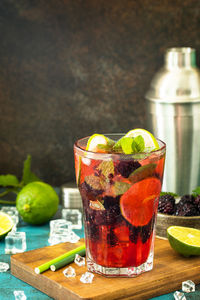 Fruits in glass on table