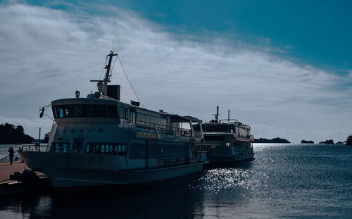 Boats in sea against sky