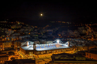 High angle view of illuminated buildings in city at night