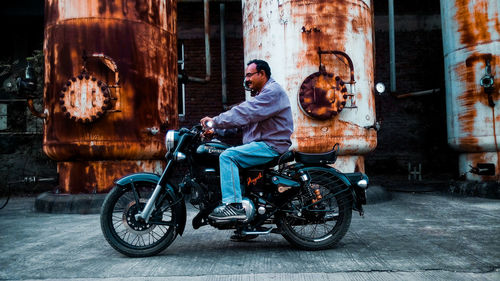 Man riding motorcycle on street