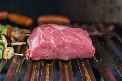 Close-up of meat on barbecue grill