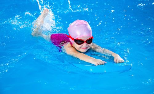 Portrait of woman swimming in pool