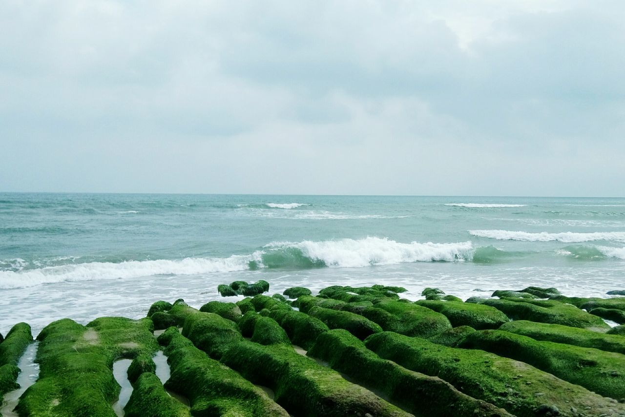 sea, horizon over water, water, beauty in nature, scenics, wave, rock - object, sky, beach, nature, tranquil scene, shore, surf, tranquility, idyllic, motion, day, rock formation, outdoors, rock