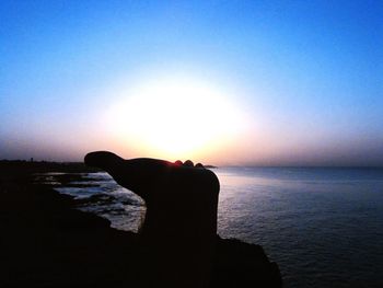 Scenic view of sea at sunset