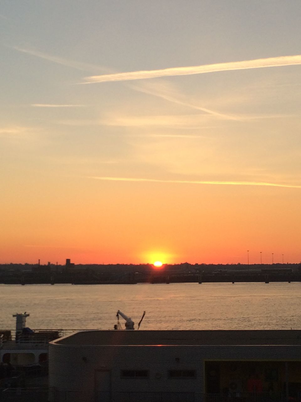 sunset, water, scenics, tranquil scene, tranquility, orange color, sky, beauty in nature, sea, sun, nature, nautical vessel, idyllic, horizon over water, waterfront, transportation, boat, silhouette, outdoors, mode of transport