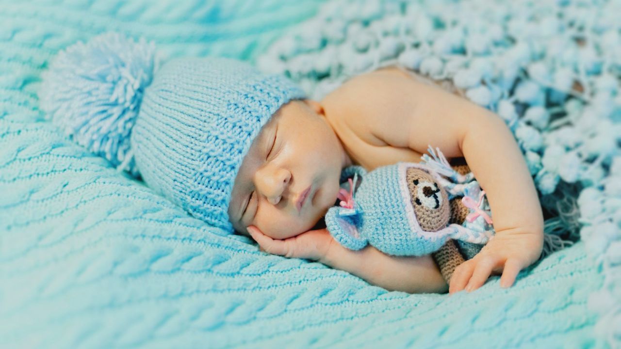 lying down, relaxation, child, childhood, one person, baby, person, blue, bed, sleeping, indoors, furniture, eyes closed, innocence, cute, bedroom, toddler, domestic room, comfortable, lying on back, resting, blanket, beginnings, newborn, lifestyles, sleep, babyhood, nature, portrait, clothing, high angle view, tranquility, full length, human face, baby clothing, selective focus, toy