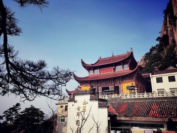 Low angle view of building against clear blue sky