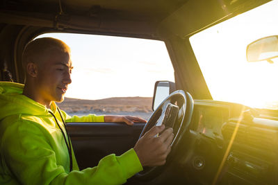 Man sitting in car
