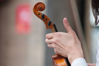 Close-up of hands playing guitar