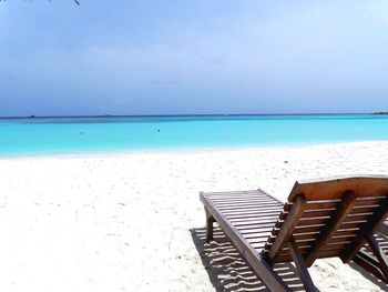 Scenic view of calm beach against sky