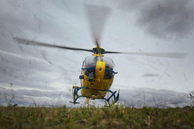 Helicopter of emergency medical service during take off from field. 