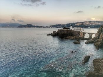 Scenic view of sea against sky at sunset