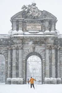 Alcala gate during heavy snowfall at madrid, spain