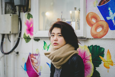 Portrait of beautiful young woman looking away