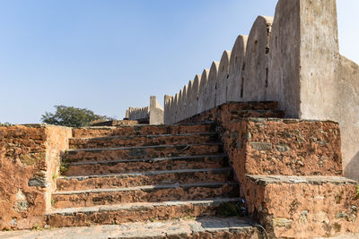 Low angle view of old ruins against clear sky